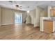 Sunlit living room with sleek flooring, neutral walls, and sliding glass doors to a private balcony at 5915 Nuevo Leon St # 7, North Las Vegas, NV 89031