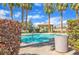 Community pool surrounded by palm trees, providing a refreshing oasis at 5915 Nuevo Leon St # 7, North Las Vegas, NV 89031