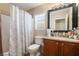 Clean bathroom with shower/tub combo and granite vanity at 6287 Felicitas Ave, Las Vegas, NV 89122