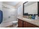 Modern bathroom with granite countertop, shower, and bathtub at 6287 Felicitas Ave, Las Vegas, NV 89122