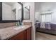 Bathroom with granite vanity and view of bedroom at 6287 Felicitas Ave, Las Vegas, NV 89122