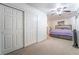 Serene bedroom with sliding closet doors and ceiling fan at 6287 Felicitas Ave, Las Vegas, NV 89122