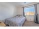 Comfortable bedroom with a queen-size bed and window at 6287 Felicitas Ave, Las Vegas, NV 89122