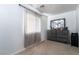 Well-lit bedroom with dresser and window coverings at 6287 Felicitas Ave, Las Vegas, NV 89122