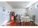 Bright dining area with table and chairs, hardwood floors, and home office space at 6287 Felicitas Ave, Las Vegas, NV 89122