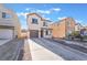 Two story house with brown garage door and landscaped yard at 6287 Felicitas Ave, Las Vegas, NV 89122