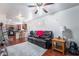 Living room with hardwood floors, leather couches and kitchen view at 6287 Felicitas Ave, Las Vegas, NV 89122