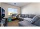 Cozy living room featuring a sectional sofa and large TV at 6287 Felicitas Ave, Las Vegas, NV 89122