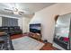 Living room with hardwood floors, leather couches and a large TV at 6287 Felicitas Ave, Las Vegas, NV 89122