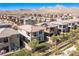 Aerial view of a two-story house with a backyard, in a neighborhood with mountain views at 712 Rogue Wave St, Las Vegas, NV 89138