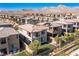 Aerial view of a two-story house with a backyard, in a neighborhood with mountain views at 712 Rogue Wave St, Las Vegas, NV 89138