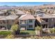 Aerial view of a two-story house with a backyard, in a neighborhood with mountain views at 712 Rogue Wave St, Las Vegas, NV 89138