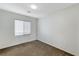 Simple bedroom with a window and neutral decor at 712 Rogue Wave St, Las Vegas, NV 89138