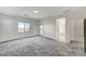 Spacious bedroom with carpet flooring, access to balcony and en-suite bathroom at 712 Rogue Wave St, Las Vegas, NV 89138