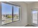 Bedroom with large window and access to balcony boasting scenic views at 712 Rogue Wave St, Las Vegas, NV 89138