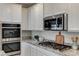 Modern kitchen with stainless steel appliances and granite countertops at 712 Rogue Wave St, Las Vegas, NV 89138