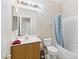 Clean bathroom with tub, shower, and wood vanity at 7450 S Eastern Ave # 2011, Las Vegas, NV 89123