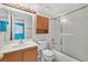 Clean bathroom with a shower/tub combo and wood vanity at 7933 Decker Canyon Dr # 101, Las Vegas, NV 89128