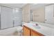 Clean bathroom with a shower/tub combo and wood vanity at 7933 Decker Canyon Dr # 101, Las Vegas, NV 89128