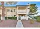 Inviting condo building exterior with landscaping and a walkway at 7933 Decker Canyon Dr # 101, Las Vegas, NV 89128