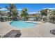 Community pool with a spa and lounge chairs at 7933 Decker Canyon Dr # 101, Las Vegas, NV 89128