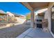 Backyard patio with built-in grill and gravel landscaping at 7933 Grey Teal St, North Las Vegas, NV 89084