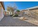 Landscaped backyard with gravel and drought-tolerant plants at 7933 Grey Teal St, North Las Vegas, NV 89084