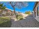 Spacious backyard with gravel, shrubs, and a fence at 7933 Grey Teal St, North Las Vegas, NV 89084