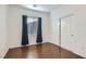 Bedroom with hardwood floors, window, and sliding door closet at 7933 Grey Teal St, North Las Vegas, NV 89084