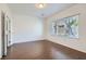 Bright bedroom with hardwood floors and large window at 7933 Grey Teal St, North Las Vegas, NV 89084