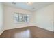 Bright bedroom with hardwood floors and large window at 7933 Grey Teal St, North Las Vegas, NV 89084