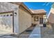 Home exterior with a walkway, two-car garage, and landscaping at 7933 Grey Teal St, North Las Vegas, NV 89084