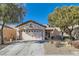 Single-story home with attached garage and landscaped front yard at 7933 Grey Teal St, North Las Vegas, NV 89084