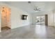 Bright living room featuring tile floors and sliding glass doors at 7933 Grey Teal St, North Las Vegas, NV 89084