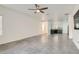 Open living room with tile floors and views into the kitchen at 7933 Grey Teal St, North Las Vegas, NV 89084