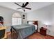 Bedroom with wood floors and ceiling fan at 8113 Hercules Dr, Las Vegas, NV 89128