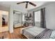 Bedroom with wood floors and mirrored closet doors at 8113 Hercules Dr, Las Vegas, NV 89128