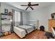 Bedroom with wood floors and ceiling fan at 8113 Hercules Dr, Las Vegas, NV 89128