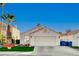 Single-story house with a two-car garage and desert landscaping at 8113 Hercules Dr, Las Vegas, NV 89128