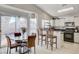 Kitchen with breakfast bar, stainless steel appliances, and view of backyard pool at 8113 Hercules Dr, Las Vegas, NV 89128