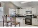 Kitchen with breakfast bar, and stainless steel appliances at 8113 Hercules Dr, Las Vegas, NV 89128