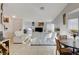 Spacious living room with white couches and a fireplace at 8113 Hercules Dr, Las Vegas, NV 89128