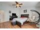 Main bedroom with wood floors and a ceiling fan at 8113 Hercules Dr, Las Vegas, NV 89128