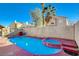 Relaxing pool area with spa and patio furniture at 8113 Hercules Dr, Las Vegas, NV 89128