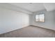 Well-lit bedroom with a window offering an outdoor view and neutral wall-to-wall carpet at 8255 S Las Vegas Bl Blvd # 718, Las Vegas, NV 89123