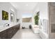 Modern bathroom with double vanity and soaking tub at 8535 Black Brush Ln, Las Vegas, NV 89131