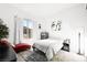 Bright bedroom with red chaise lounge and window at 8535 Black Brush Ln, Las Vegas, NV 89131