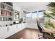 Home office with built-in shelving and hardwood floors at 8535 Black Brush Ln, Las Vegas, NV 89131