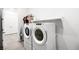 Washer and dryer in spacious laundry room with extra storage at 8535 Black Brush Ln, Las Vegas, NV 89131