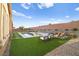 Inviting pool and spa with artificial turf and patio furniture at 8535 Black Brush Ln, Las Vegas, NV 89131